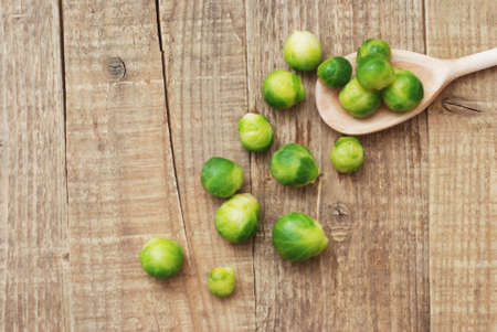 Brussel Sprout Vegetable isolated Rustic Wooden Background