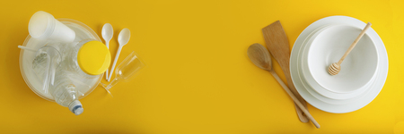 Traditional Clasic Breakfast Fried Eggs and Sausage on a white Square Porcelain Plate. Isoalted on Blue Background. Banner.の写真素材