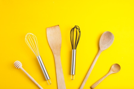Tools pastry kitchen utensile for cooking dessert, over yellow background, still life.の写真素材