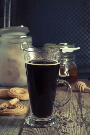 Espresso coffee. Espresso drink with cream, topped with whipped cream. Rustic wooden background.の写真素材