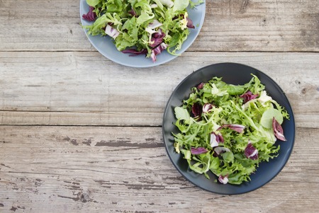 Fresh green salad with spinach,arugula,romaine and lettuceの写真素材