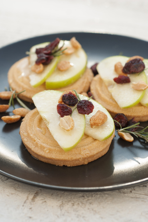 Crispy butter cookies, biscuits with apple slices and honey. Delicious breakfast or snack.の写真素材