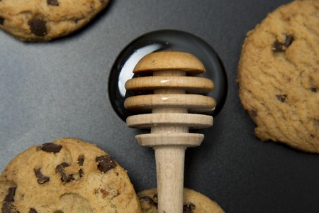 Chocolate chip cookies on dark background. Choco cookie black slate board. Isolated.