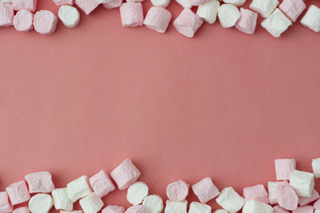 Marshmallow on pink, board. Christmas backgound with copy space.の写真素材
