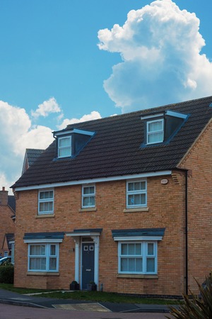 Traditional english house, brick house. Outdoor street view Corby, United Kingdomの写真素材