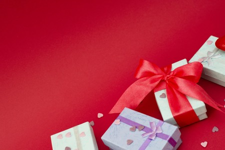 Many colorful gift boxes on redの写真素材