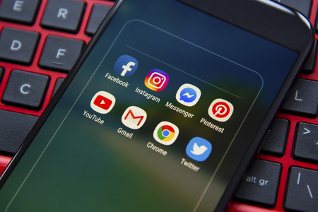 Corby, United Kingdom - January 27, 2019: Smartphone with icons of social media on screen,...