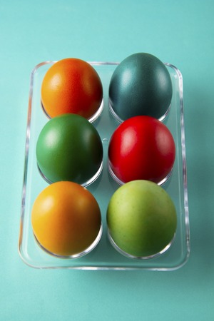 Easter eggs over blue background. Easter colorful eggs over blue background. Spring holiday...