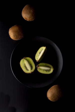 Kiwi fruit isolated on black background, fresh kiwi fruit. Summer vitamine fruit. Healthy food or dessert.の写真素材