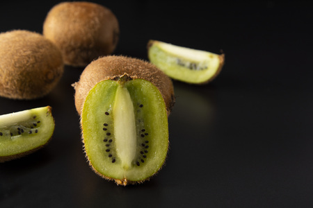 Kiwi fruit isolated on black background, fresh kiwi fruit. Summer vitamine fruit. Healthy food or dessert.の写真素材