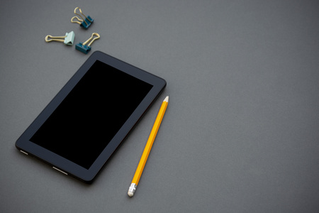 Workplace. Phone, tablet and notepad on the tableの写真素材