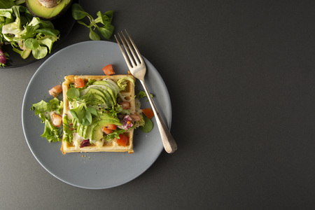 Belgian Waffles with avocado and tomatoes. Perfect breakfast for healthy food or lose weight....
