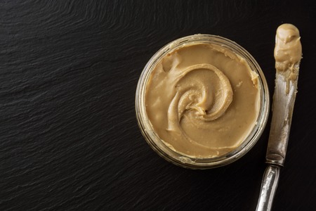 Peanuts and Fresh Peanut Butter Isolated Black Background Protein Super Food Snack. Copy Space.の写真素材