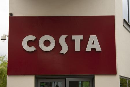 Corby, U.K - April 28, 2019 - Big banner of Costa coffee shop outdoor front store.のeditorial素材