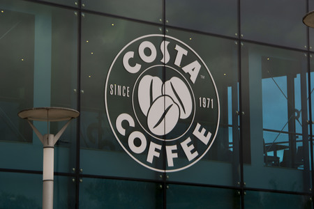 Corby, U.K, april 28, 2019 - Costa sign logo on window display coffee shopのeditorial素材