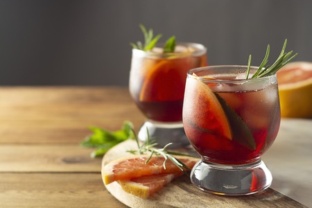 Summer drink. Fruit refreshing cold cocktail. Wooden tableの写真素材