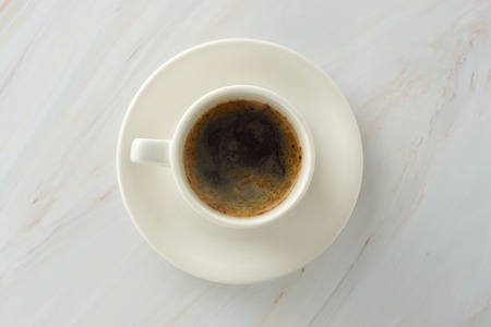 Coffee cup on marble table background. Coffee breake.