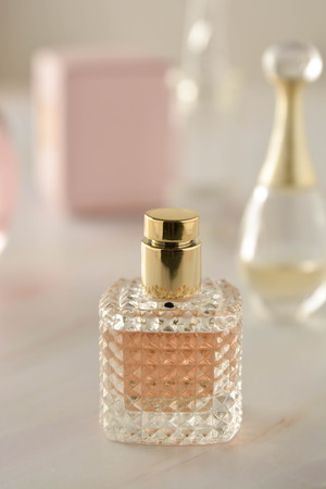Beauty products. Perfume or parfume bottle on marble background. Copy spaceの写真素材