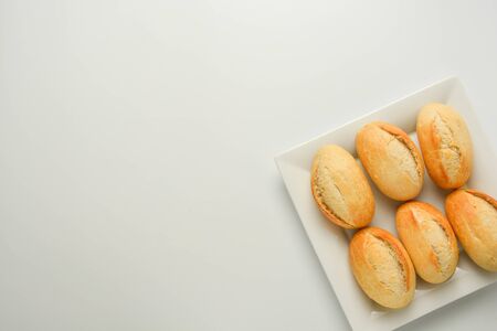 Whole grain wheat bread buns isolated on whiteの写真素材