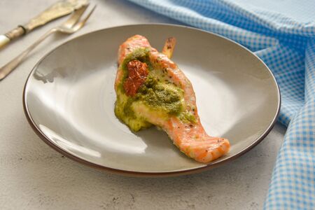 Baked salmon filled with with cherry and pesto.の写真素材