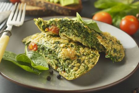 Omelet with spinach leaves. Healthy omelette for lose weight. Healthy food. Breakfast.の写真素材