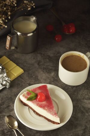 Cheese cake with cherry on dark background. Homemade cake, desserts.の写真素材