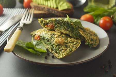 Omelet with spinach leaves. Healthy omelette for lose weight. Healthy food. Breakfast.の写真素材