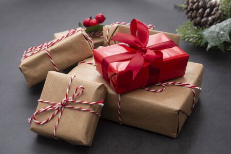 Christmas  with craft gift boxes, fir branches and pine cones.の写真素材