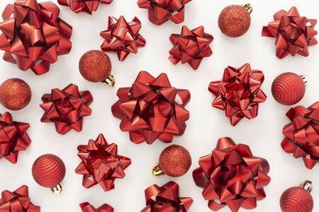 Red ribbon bows over white background. Christmas mock up frame or border. Copy space.の写真素材