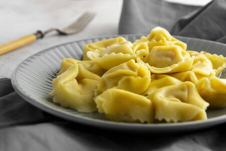 Cooked tortellini on a plate, close up pasta, italian food close up.の写真素材