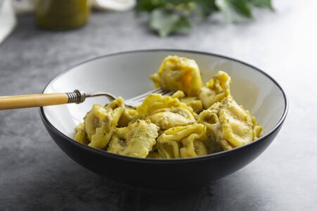 Cooked tortellini on a plate, close up pasta, italian food.の写真素材