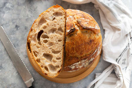 Sourdough bread slices, on a cutting board. Organic homemade bread.