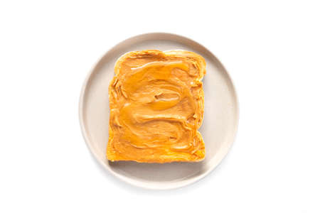 Peanut butter sandwich with slice of white bread, isolated over white backgroundの写真素材