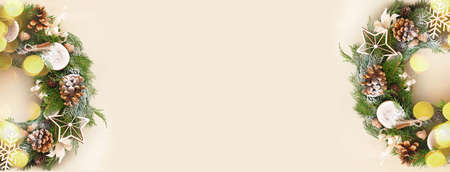 Christmas banner with rustic wreath decorate with golden baubles. Copy space for textの写真素材