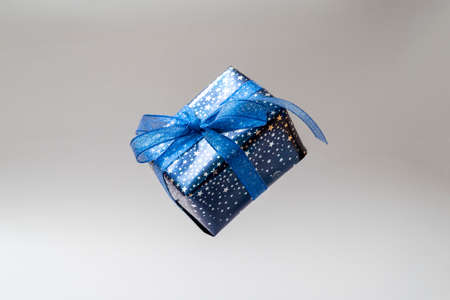 Gift blue box with blue bow. Christmas sinlge, gift box isolated