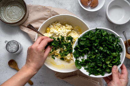 Cooking spinach quiche healthy homemade tart with spinach and cheese. Step by step recipe. Top view.