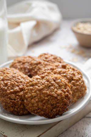 Close up homemade oat cookies, healthy snack on bright background
