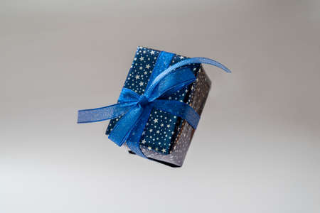 Gift blue box with blue bow. Christmas sinlge, gift box isolatedの写真素材