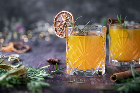 Winter drink with oranges, dried orange slice, cinnamon and rosemary. Party drinksの写真素材
