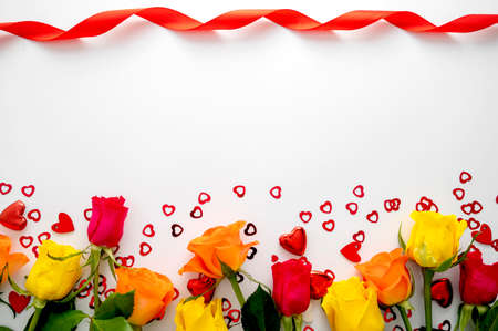 Background with rose flowers and heart glitter on white background, copy space for textの写真素材