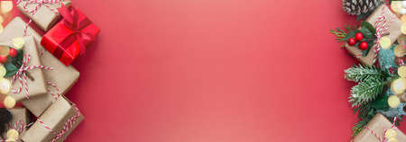 Craft gift boxes Christmas banner on red background with copy space for textの写真素材