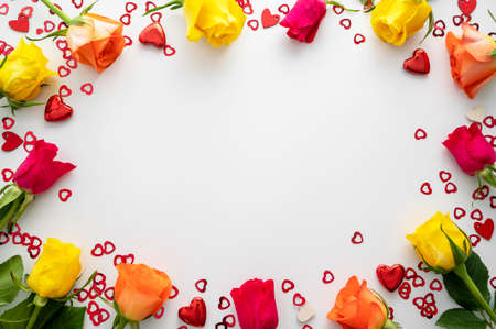 Valentine's day frame, with rose flowers and, heart glitter on white background, copy space for textの写真素材