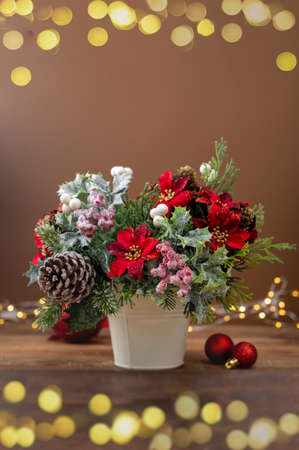 Christmas greeting card, red poinsettia, pine cones, fir branches, vertical imageの写真素材