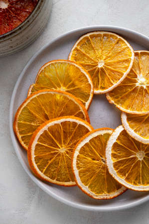 dried orange slices isolated on white backgroundの写真素材