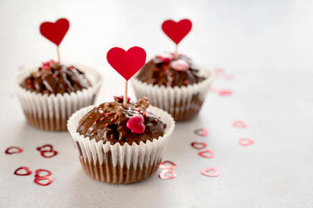 Valentine's day, chocolate homemade cupcakes with heart sprinklesの写真素材