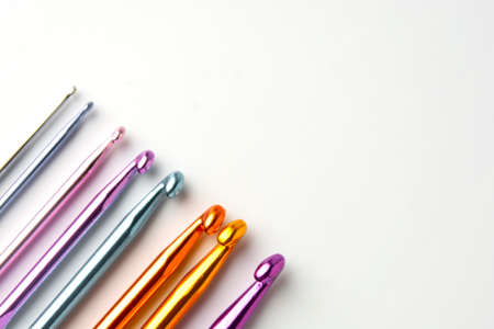 Crochet hooks set in special case, on white background. Craf and knit concept.