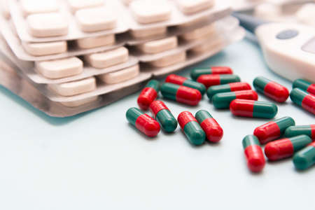 Close up pills with many capsules in background. Virus infection. Copy space for text.の写真素材