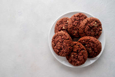 Oatmeal red velvet cookies nuts and seeds on bright background. Top viewの写真素材