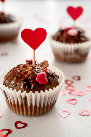 Valentine's day, chocolate homemade cupcakes with heart sprinklesの写真素材