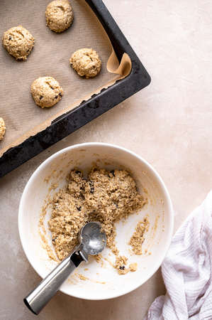 Gluten free raw, uncooked banana cookies with chocolate chips. Healthy homemade biscuits, top view